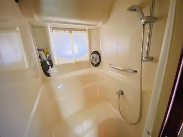 Slide: The Image of Luxurious bathroom in 2008 Sea Ray 440 Sundancer yacht with shower amenities. - 27