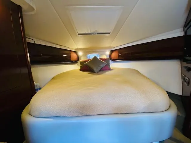 Slide: The Image of Luxurious cabin interior of 2008 Sea Ray 440 Sundancer yacht with cozy bedding. - 29