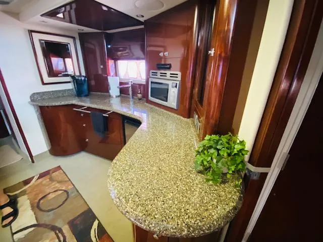 Slide: The Image of Luxurious 2008 Sea Ray 440 Sundancer yacht interior with modern kitchen and sleek countertops. - 37