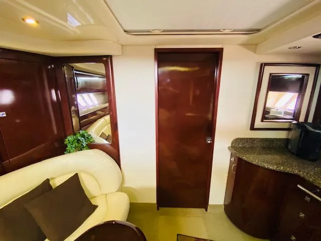 Slide: The Image of Luxurious interior of 2008 Sea Ray 440 Sundancer yacht with elegant wood finishes. - 38