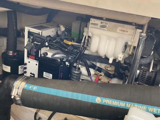 Slide: The Image of Engine compartment of 2008 Sea Ray 440 Sundancer with visible wiring and components. - 41