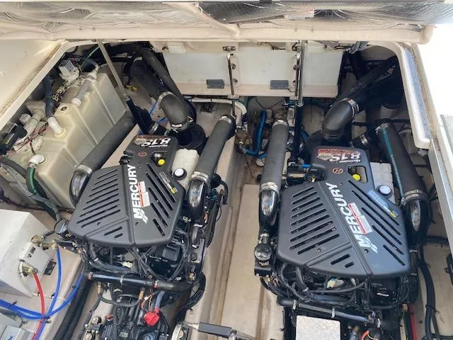 Slide: The Image of Engine compartment of 2008 Sea Ray 440 Sundancer with twin Mercury engines. - 42