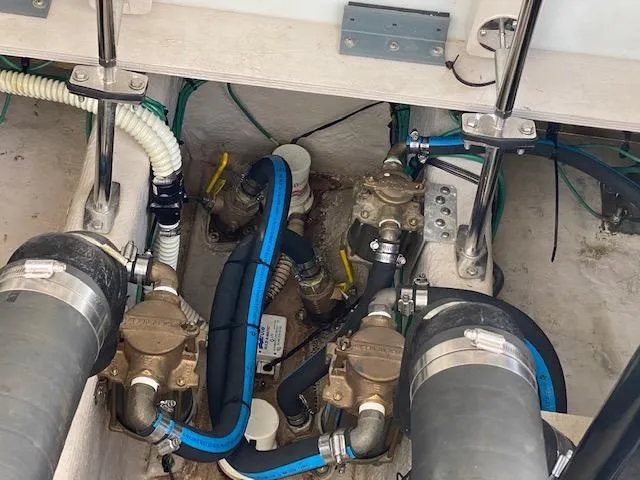 Slide: The Image of Engine compartment of 2008 Sea Ray 440 Sundancer with visible hoses and fittings. - 43