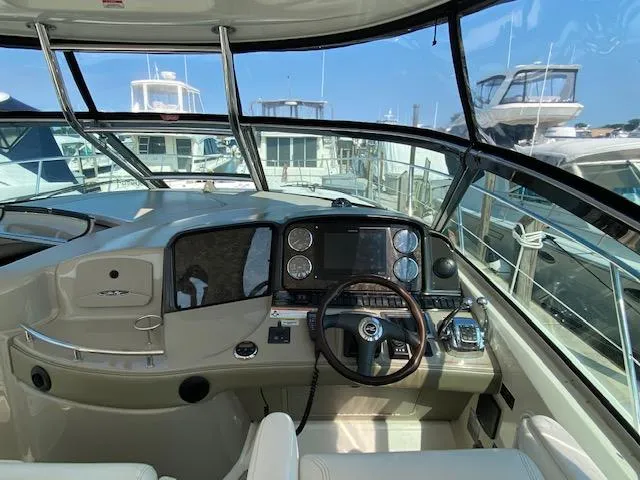 Slide: The Image of Interior helm of 2008 Sea Ray 440 Sundancer yacht, featuring modern navigation controls. - 9