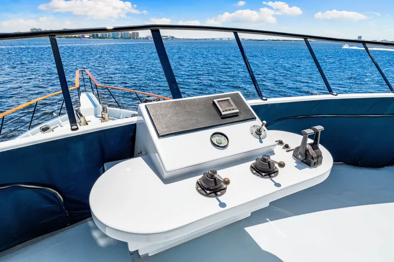 Slide: The Image of Expedition Freeport Yachts 1991 helm, ocean view, clear sky, luxury boating experience. - 30