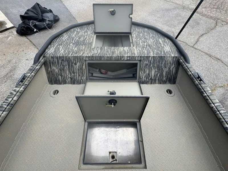 Slide: The Image of 2025 SeaArk Predator boat interior with dual seats and steering console. - 15