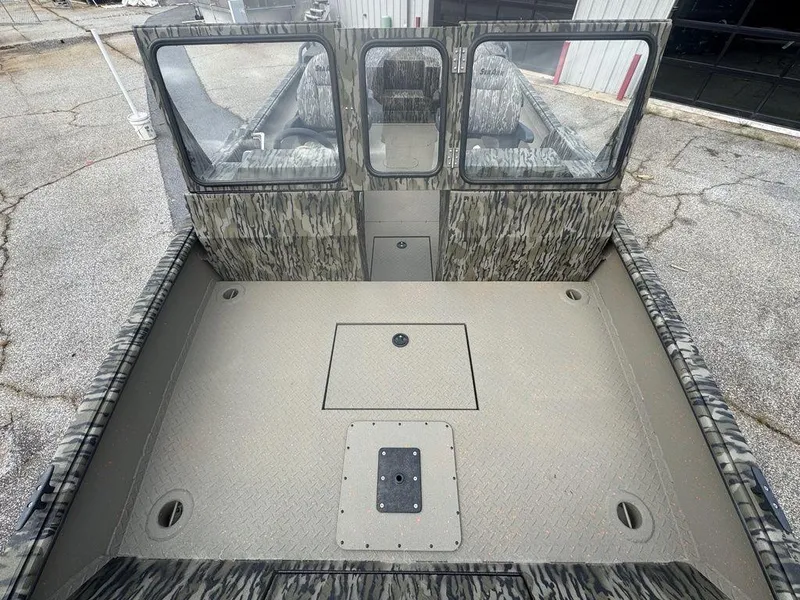 Slide: The Image of 2025 SeaArk Predator boat interior with four seats, gray and black design. - 17