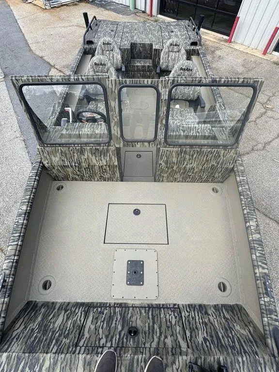 Slide: The Image of Engine compartment of a 2025 SeaArk Predator boat, showcasing modern marine engine components. - 19