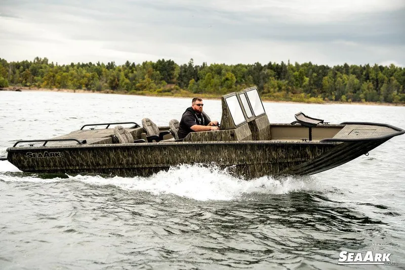 Slide: The Image of 2025 SeaArk Predator boat interior with seating and storage compartments. - 26