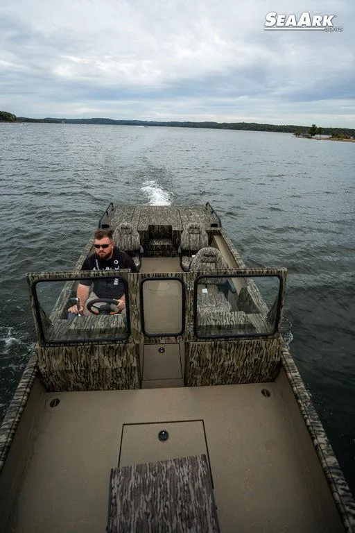 Slide: The Image of 2025 SeaArk Predator boat on trailer, featuring sleek design and dual axles. - 4