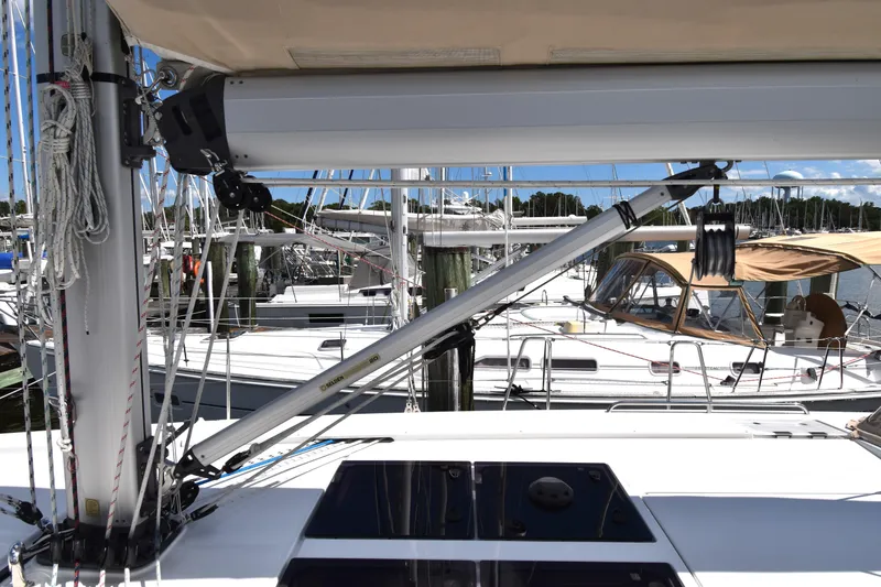 Slide: The Image of 2019 Hanse 458 sailboat deck with rigging and marina background. - 11