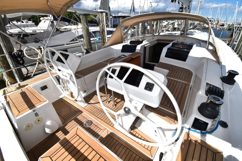Slide: The Image of 2019 Hanse 458 yacht cockpit with dual steering wheels and teak decking. - 15
