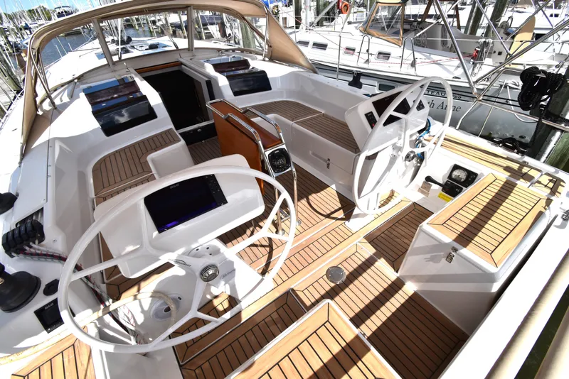 Slide: The Image of 2019 Hanse 458 yacht cockpit with dual steering wheels and teak flooring. - 16