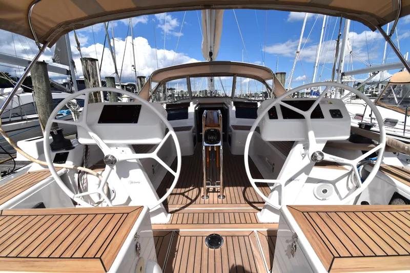 Slide: The Image of 2019 Hanse 458 yacht cockpit with dual steering wheels and teak decking. - 17