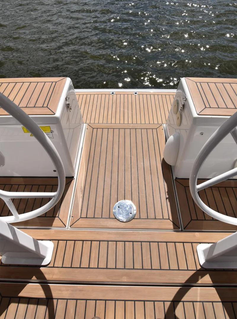 Slide: The Image of Teak deck of 2019 Hanse 458 yacht with water view. - 18