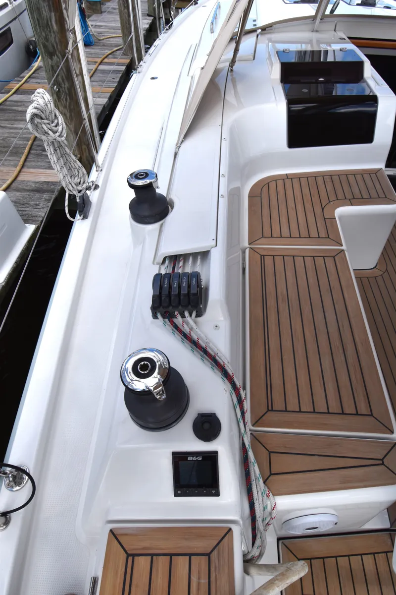 Slide: The Image of 2019 Hanse 458 yacht deck with teak flooring and winches. - 20