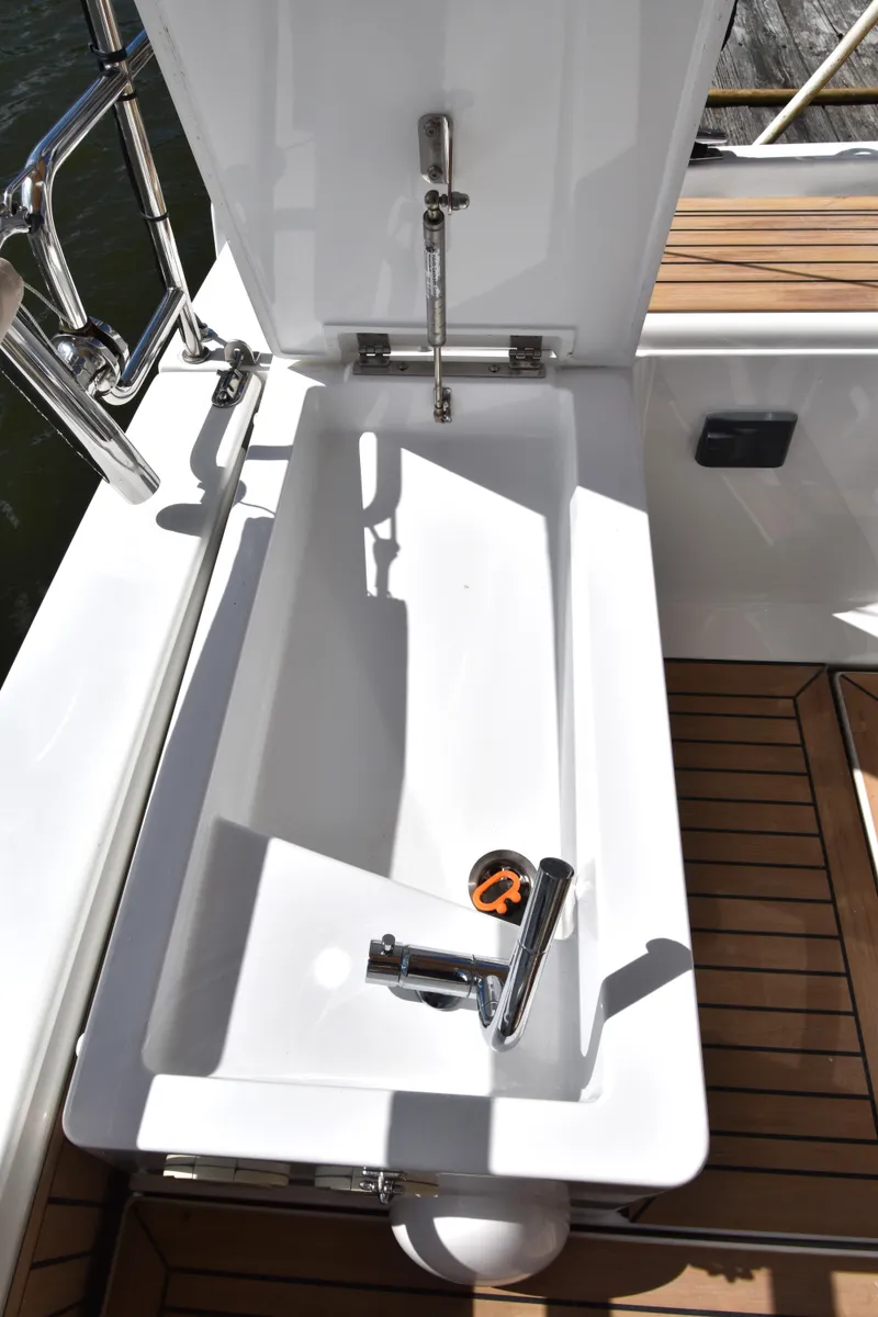 Slide: The Image of Hanse 458 yacht sink with modern faucet, 2019 model, on teak deck. - 23