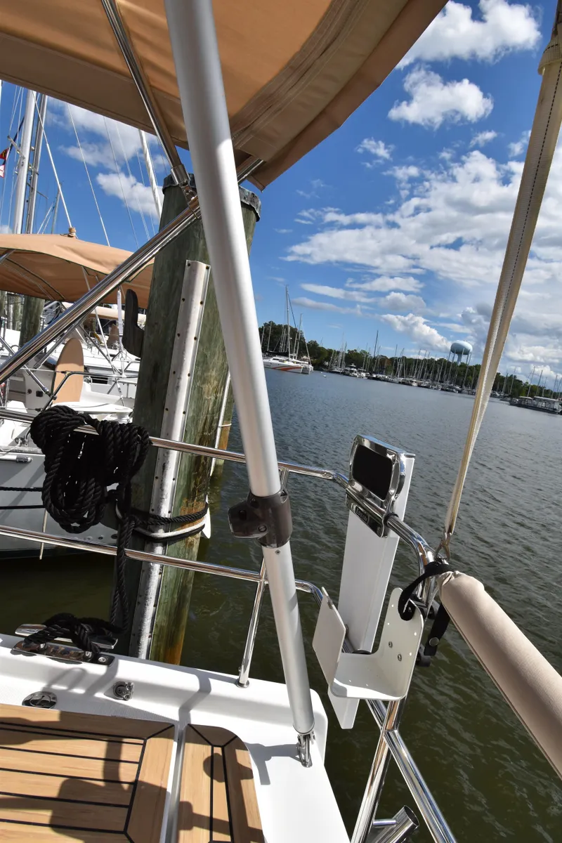 Slide: The Image of 2019 Hanse 458 yacht docked at marina under blue sky. - 28
