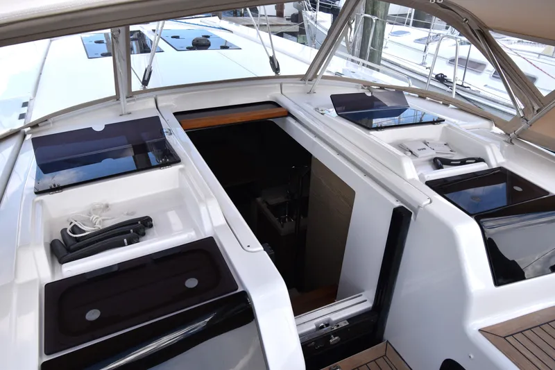 Slide: The Image of 2019 Hanse 458 yacht cockpit with open hatch and sleek design. - 29