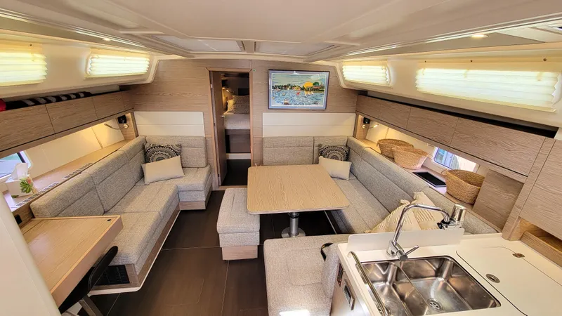 Slide: The Image of Luxurious interior of 2019 Hanse 458 yacht with modern seating and dining area. - 30