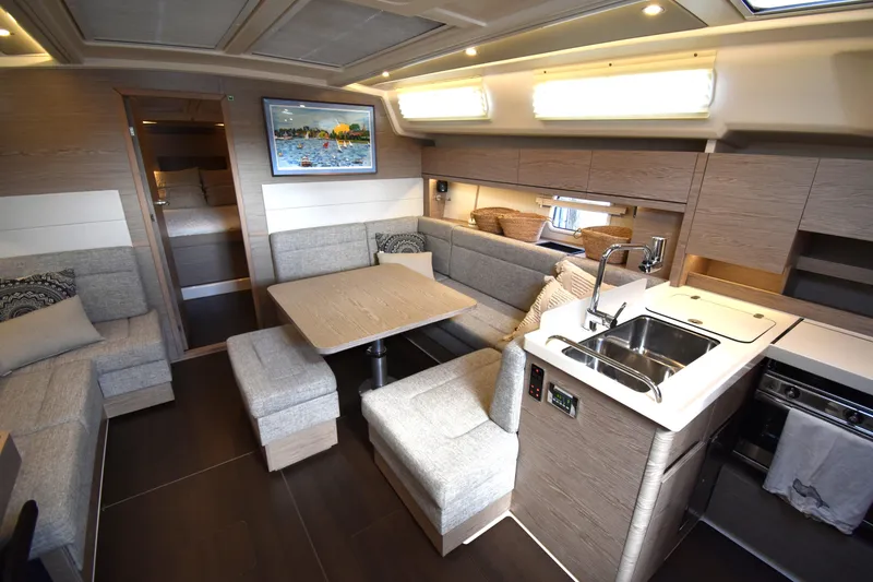 Slide: The Image of Luxurious 2019 Hanse 458 yacht interior with modern kitchen and cozy seating area. - 33