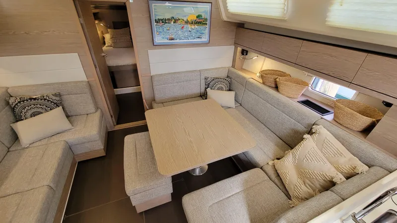 Slide: The Image of Luxurious 2019 Hanse 458 yacht interior with cozy seating and elegant decor. - 35