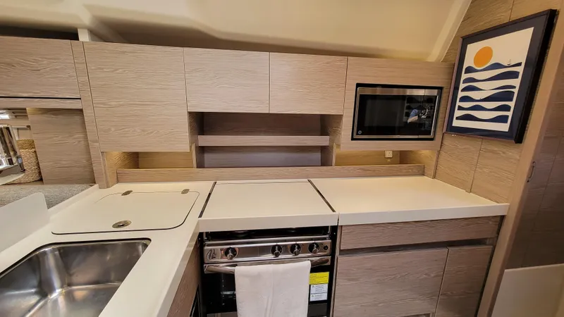 Slide: The Image of Modern kitchen in 2019 Hanse 458 yacht with sleek cabinetry and appliances. - 37