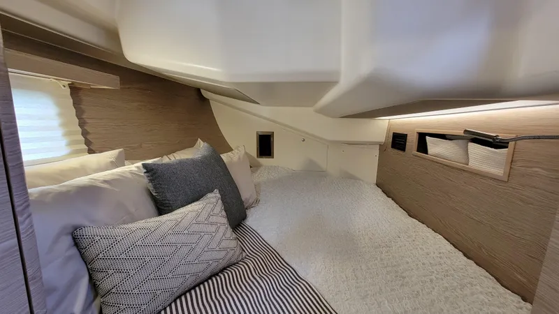 Slide: The Image of Cozy interior cabin of 2019 Hanse 458 yacht with plush bedding and modern design. - 41
