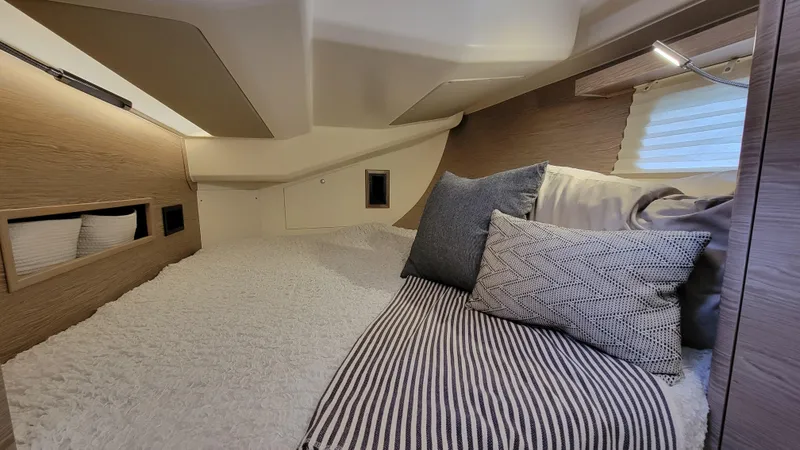 Slide: The Image of Luxurious interior cabin of 2019 Hanse 458 yacht with cozy bedding and modern design. - 43