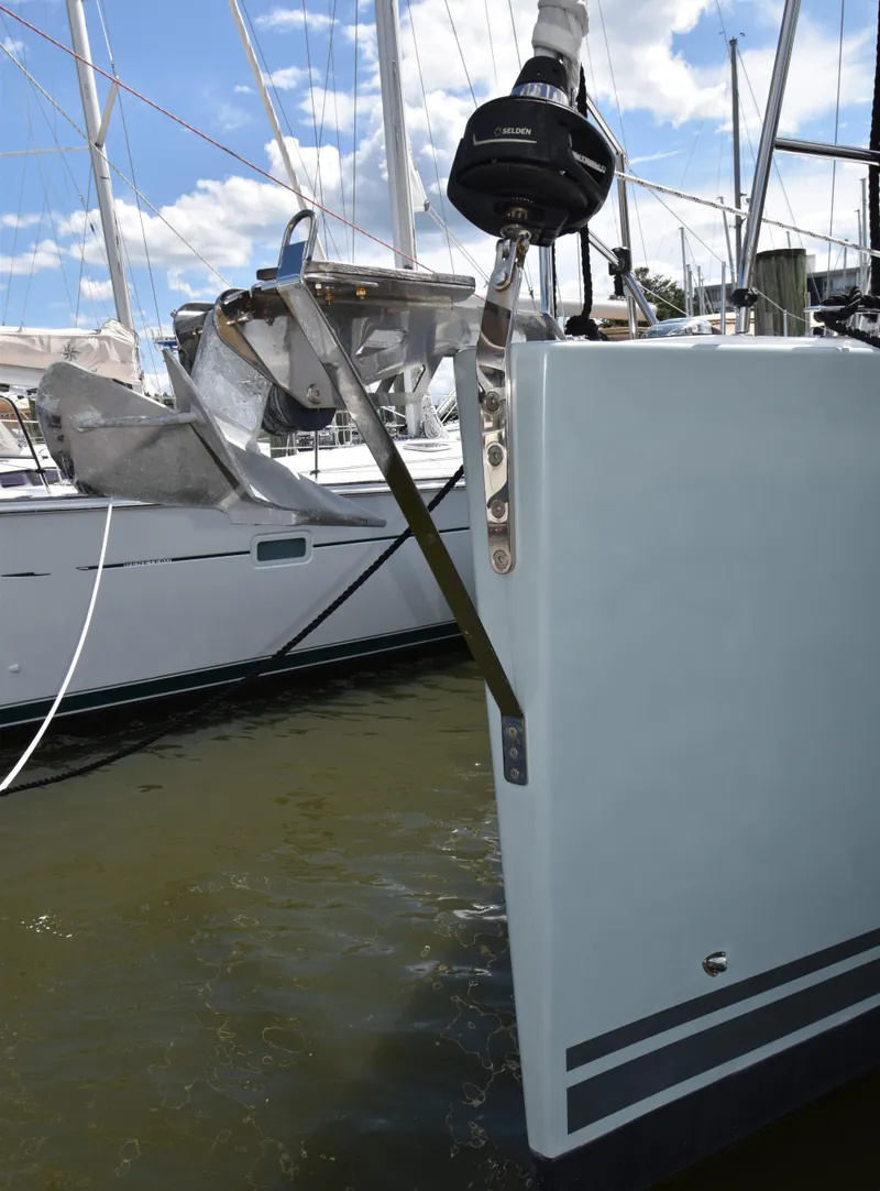 Slide: The Image of Hanse 458 sailboat stern view, docked, 2019 model, with clear sky background. - 5