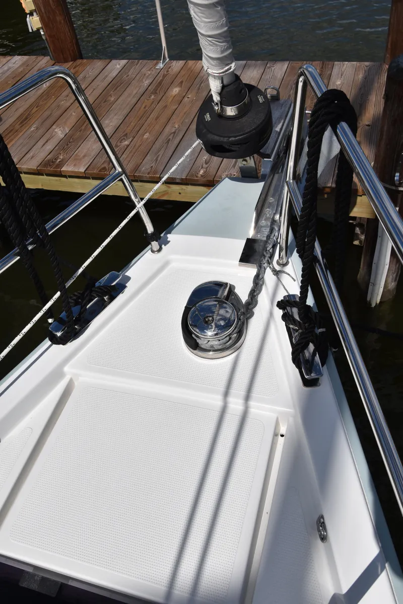 Slide: The Image of Bow of 2019 Hanse 458 yacht with anchor winch and railing. - 6
