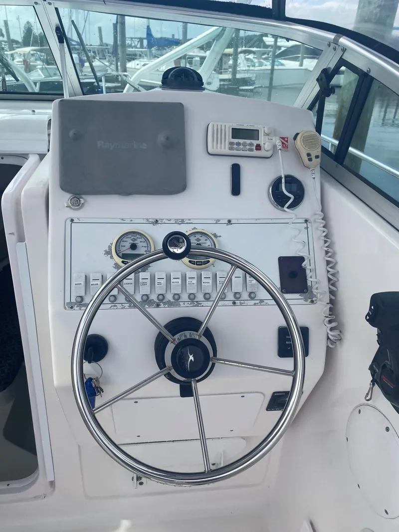 Slide: The Image of Helm console of a 2005 Pro-Line 24 Walkaround boat. - 2