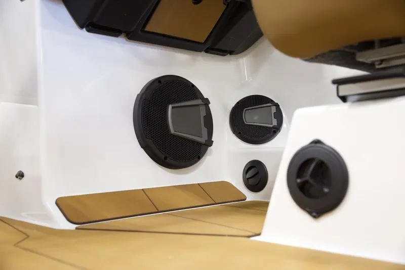 Slide: The Image of 2025 Axis A225 boat interior with modern speaker system and sleek design. - 13