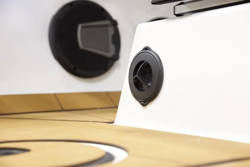 Slide: The Image of Axis A225 2025 boat interior with speaker and wooden flooring. - 15