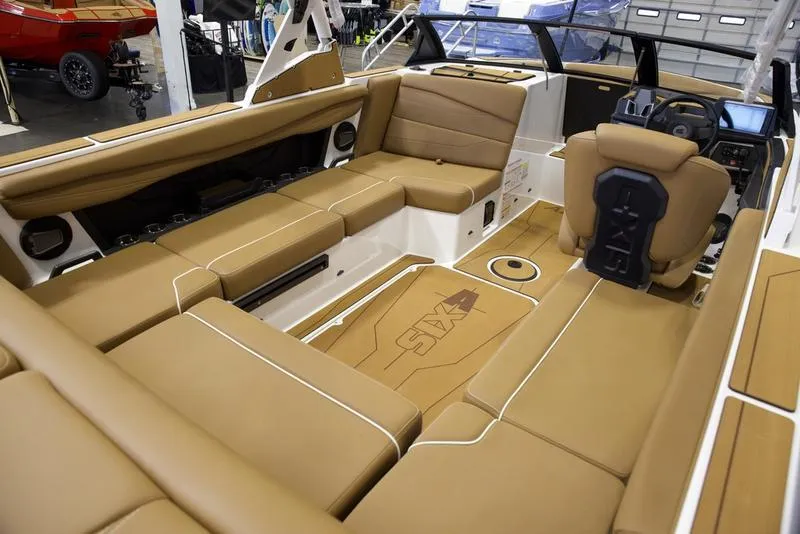 Slide: The Image of Luxurious interior of 2025 Axis A225 boat with tan leather seating. - 16