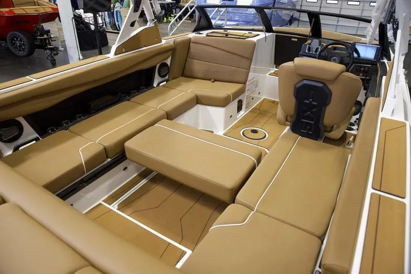Slide: The Image of Luxurious interior of 2025 Axis A225 boat with tan leather seating. - 18