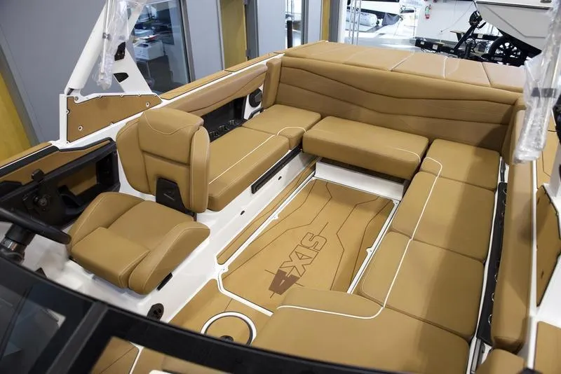 Slide: The Image of 2025 Axis A225 boat interior with tan leather seating and modern design. - 20