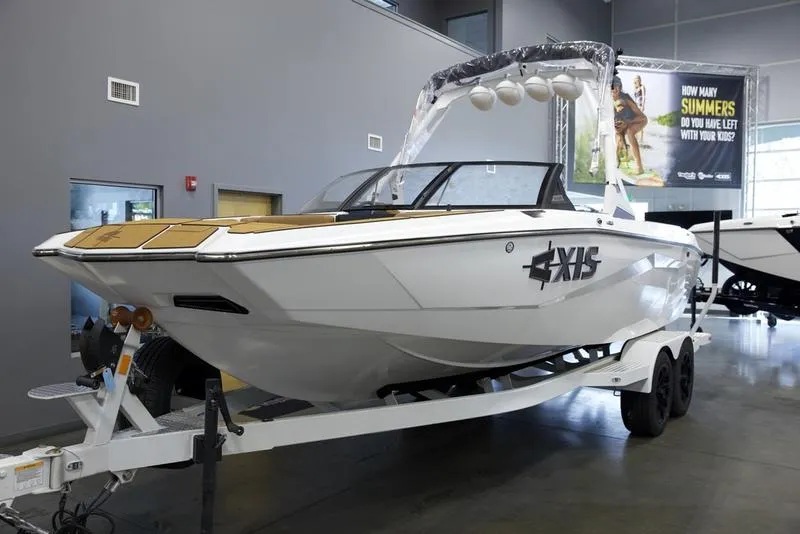 Slide: The Image of 2025 Axis A225 boat on trailer in showroom. - 3