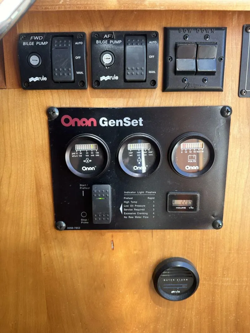 Slide: The Image of Control panel of a 2003 Sabre 36 Fly Bridge Sedan with Onan GenSet gauges. - 12