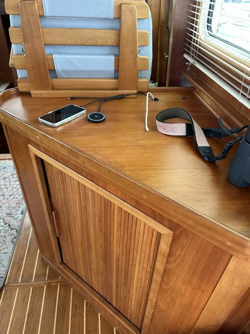 Slide: The Image of 2003 Sabre 36 Fly Bridge Sedan interior with wooden cabinet and accessories. - 28