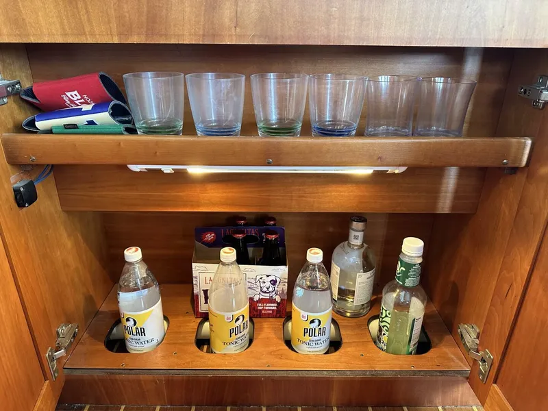 Slide: The Image of Cabinet with glasses and beverages on a 2003 Sabre 36 Fly Bridge Sedan. - 32
