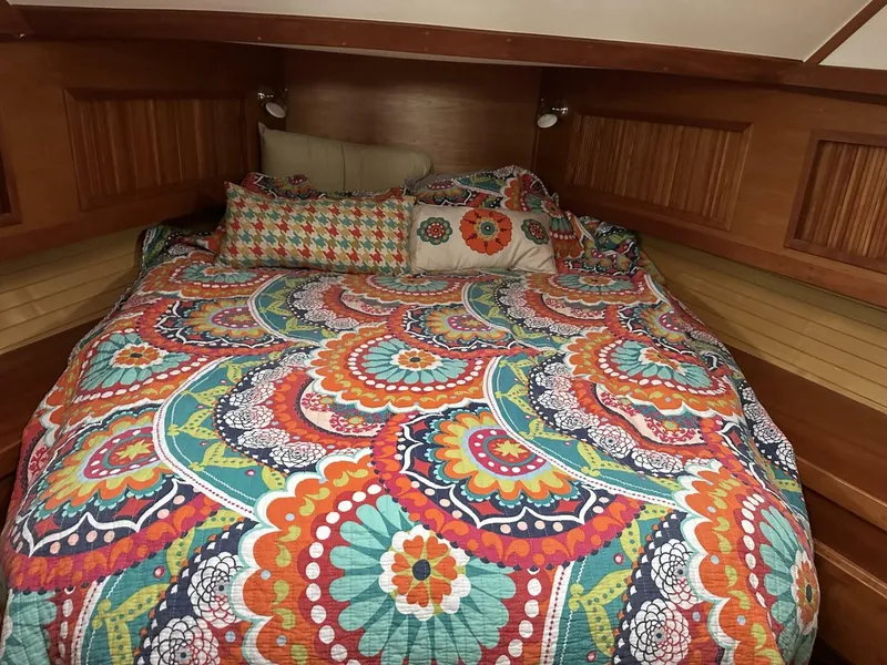 Slide: The Image of Cozy cabin bed with colorful quilt in 2003 Sabre 36 Fly Bridge Sedan. - 39