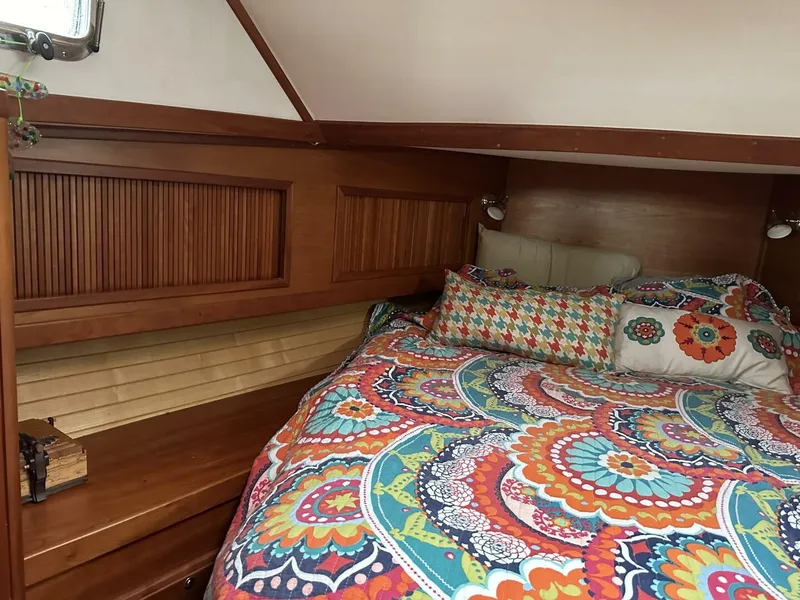 Slide: The Image of Cozy cabin interior of 2003 Sabre 36 Fly Bridge Sedan with colorful bedding. - 40