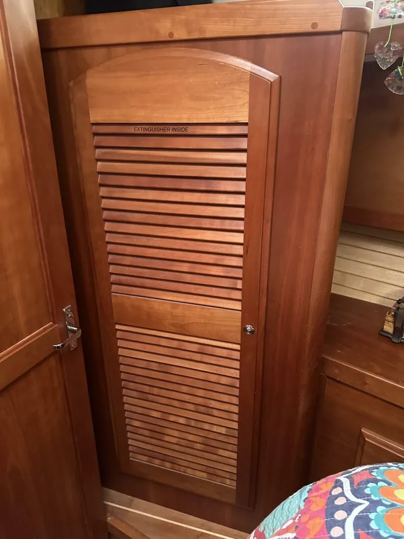Slide: The Image of Wooden cabinet door inside 2003 Sabre 36 Fly Bridge Sedan boat interior. - 44
