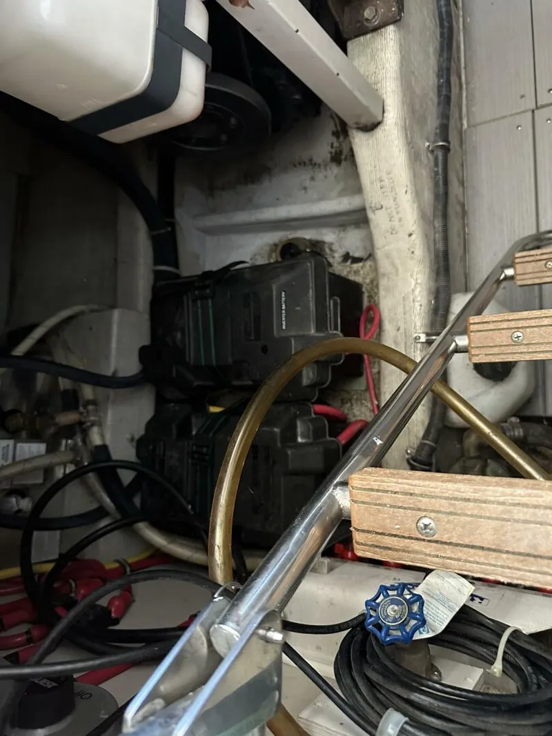 Slide: The Image of Engine compartment of a 2003 Sabre 36 Fly Bridge Sedan with visible components and wiring. - 47