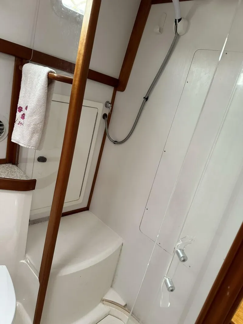 Slide: The Image of 2003 Sabre 36 Fly Bridge Sedan bathroom with shower and towel rack. - 49