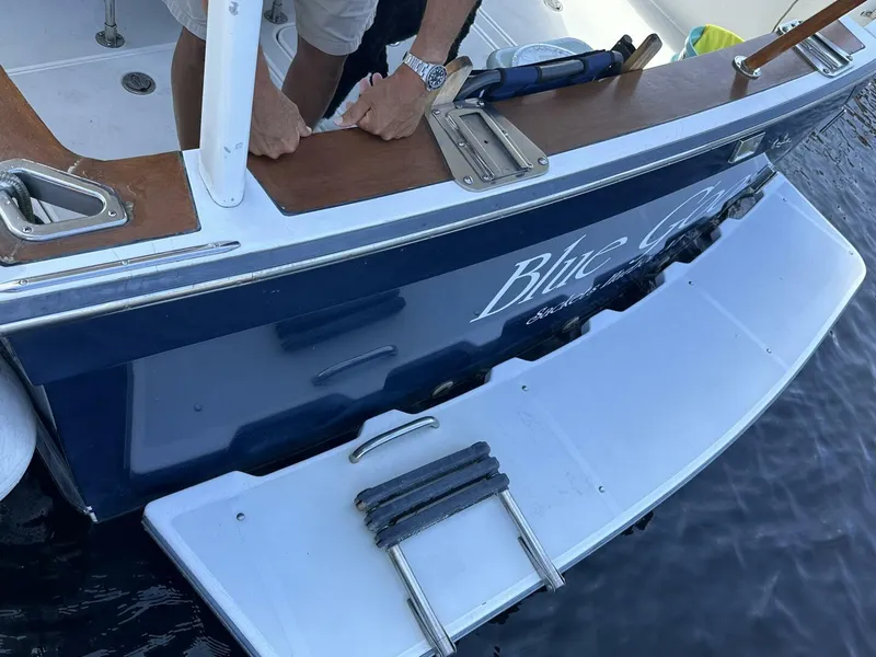 Slide: The Image of 2003 Sabre 36 Fly Bridge Sedan boat stern with swim platform and ladder. - 7