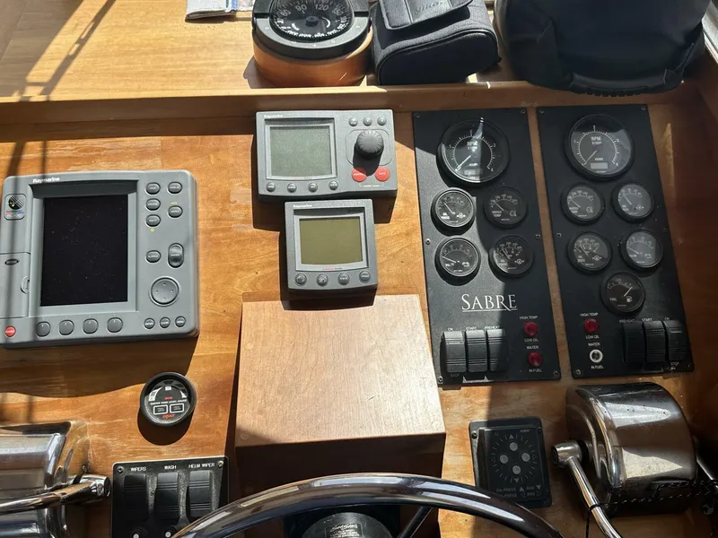 Slide: The Image of Control panel of 2003 Sabre 36 Fly Bridge Sedan with gauges and navigation equipment. - 9