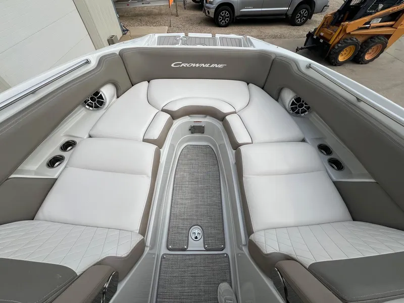 Slide: The Image of 2019 Crownline Eclipse E285 boat interior with plush seating and cup holders. - 10