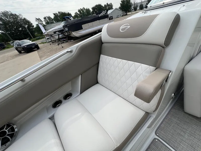 Slide: The Image of 2019 Crownline Eclipse E285 boat interior with luxurious seating and armrest. - 13